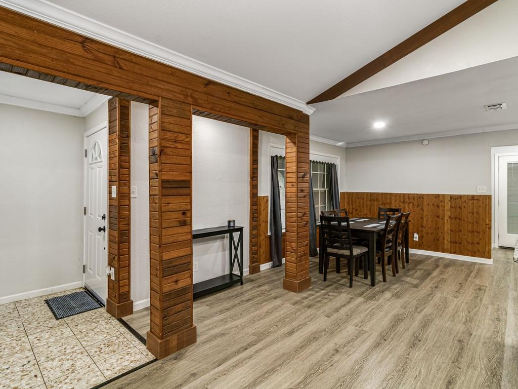 203 Hogg Street Streetman, TX 75859 - Photo 10 of 36 a view of a dining room with furniture and wooden floor