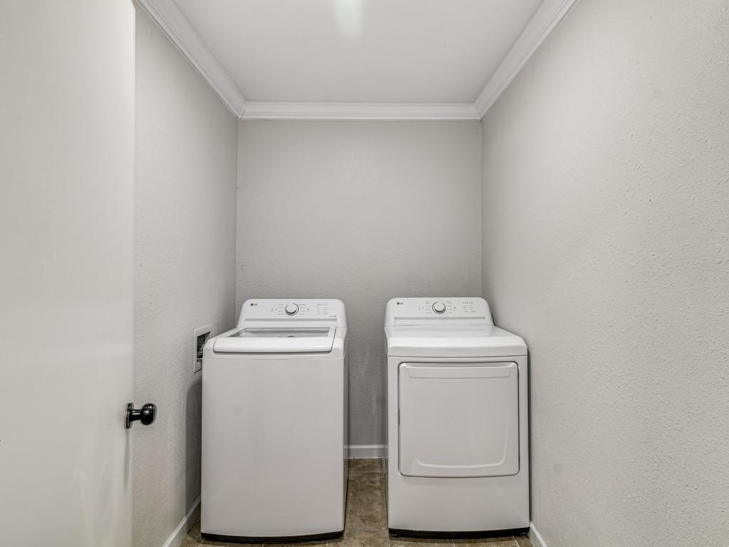 203 Hogg Street Streetman, TX 75859 - Photo 18 of 36 a utility room with dryer and washer