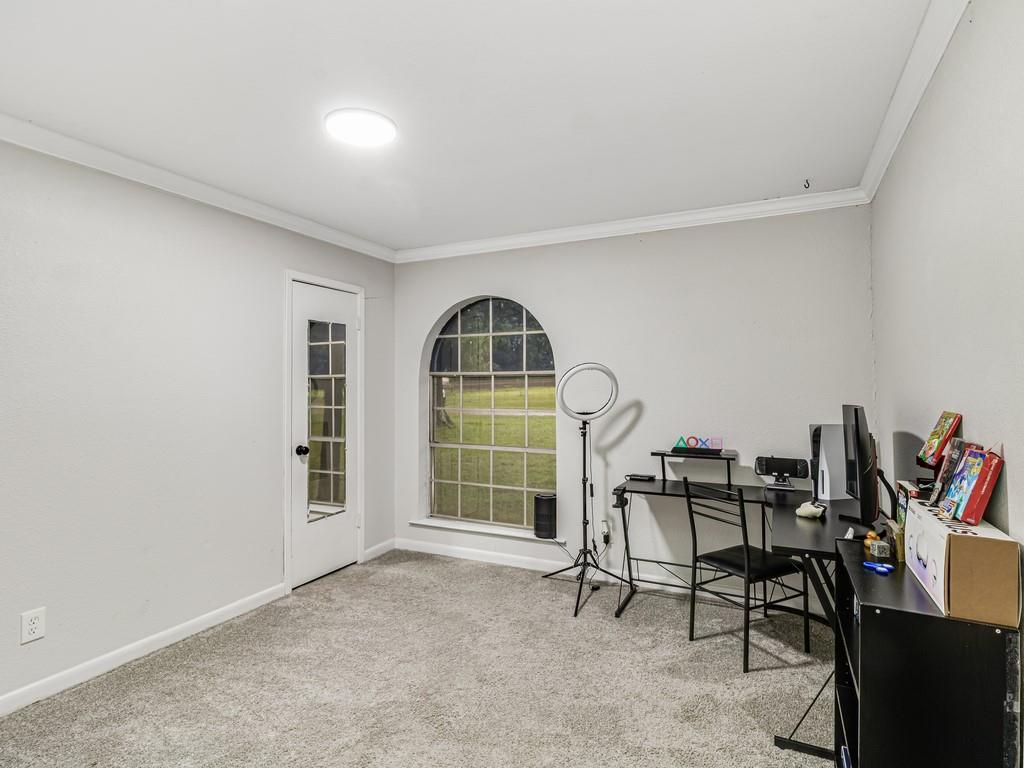 203 Hogg Street Streetman, TX 75859 - Photo 29 of 36 a workspace room with furniture and a window