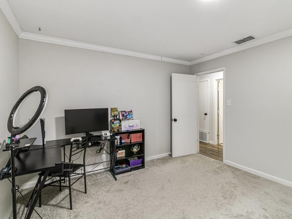 203 Hogg Street Streetman, TX 75859 - Photo 30 of 36 a view of a workspace with furniture and a window