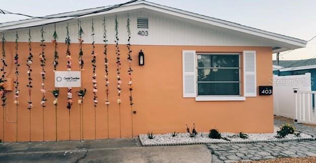 403 63rd Street Holmes Beach, FL 34217 - Photo 1 of 81 a front view of a house