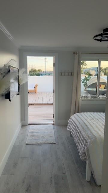 403 63rd Street Holmes Beach, FL 34217 - Photo 12 of 81 a bedroom with a bed and a window