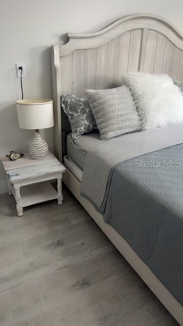 403 63rd Street Holmes Beach, FL 34217 - Photo 18 of 81 a bedroom with a bed and window