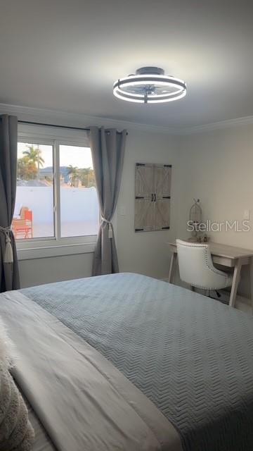 403 63rd Street Holmes Beach, FL 34217 - Photo 21 of 81 a bedroom with a large bed and a large window