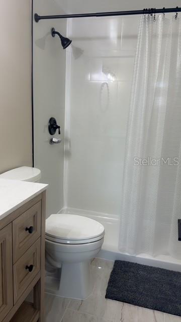 403 63rd Street Holmes Beach, FL 34217 - Photo 27 of 81 a bathroom with a toilet and a shower