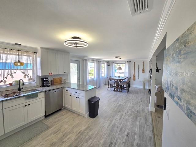 403 63rd Street Holmes Beach, FL 34217 - Photo 33 of 81 a kitchen with sink stove and cabinets
