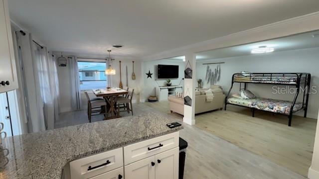 403 63rd Street Holmes Beach, FL 34217 - Photo 37 of 81 a living room with furniture and a flat screen tv