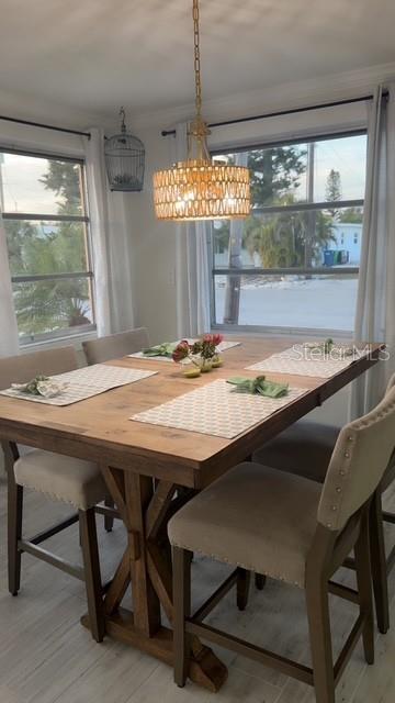 403 63rd Street Holmes Beach, FL 34217 - Photo 39 of 81 a dining room with furniture and window