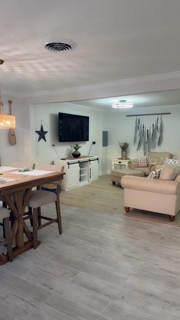 403 63rd Street Holmes Beach, FL 34217 - Photo 42 of 81 a living room with furniture and a flat screen tv