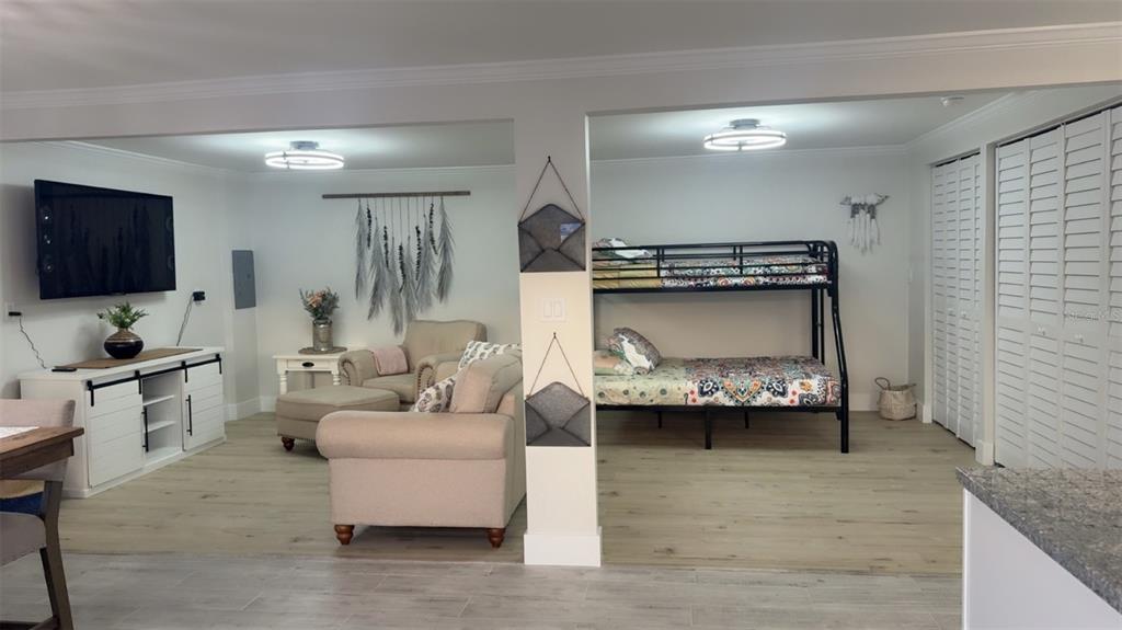 403 63rd Street Holmes Beach, FL 34217 - Photo 43 of 81 a living room with furniture and a flat screen tv