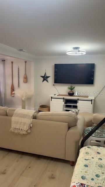 403 63rd Street Holmes Beach, FL 34217 - Photo 46 of 81 a living room with furniture and a flat screen tv