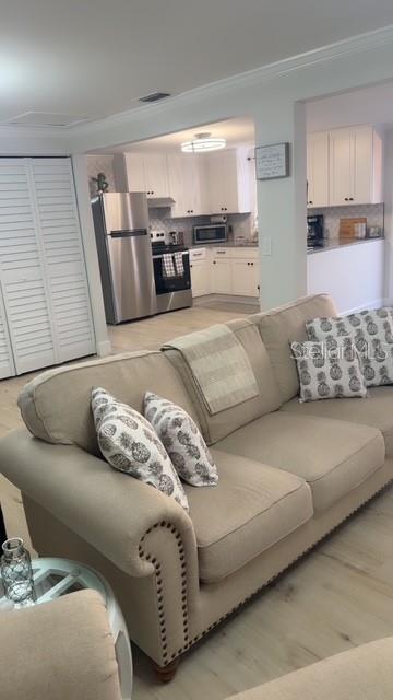 403 63rd Street Holmes Beach, FL 34217 - Photo 48 of 81 a living room with furniture and kitchen view