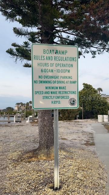 403 63rd Street Holmes Beach, FL 34217 - Photo 58 of 81 a sign on the side of a road
