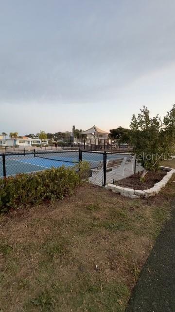 403 63rd Street Holmes Beach, FL 34217 - Photo 64 of 81 a view of a dry yard with wooden fence