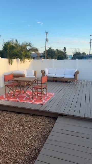 403 63rd Street Holmes Beach, FL 34217 - Photo 7 of 81 a view of a lake with a table and chairs