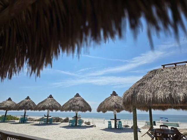 403 63rd Street Holmes Beach, FL 34217 - Photo 80 of 81 a couple of lawn chairs sitting under a large umbrella