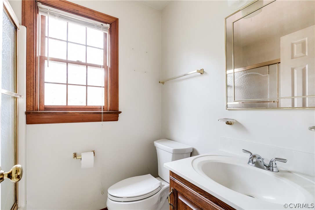 11036 Rufford Road Chester, VA 23831 - Photo 21 of 35 a white toilet sitting next to a bathroom sink