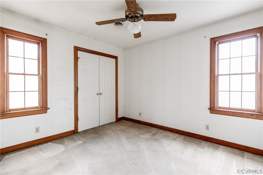 11036 Rufford Road Chester, VA 23831 - Photo 23 of 35 an empty room with windows and fan