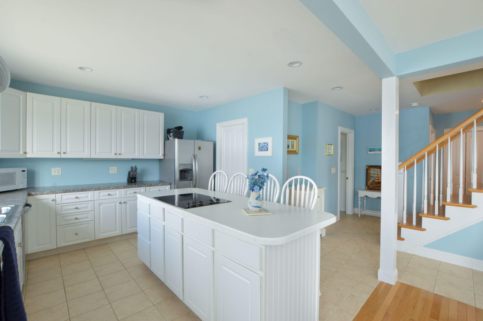 97 Willow Run Drive Centerville, MA 02632 - Photo 13 of 30 a kitchen with granite countertop a sink and white cabinets