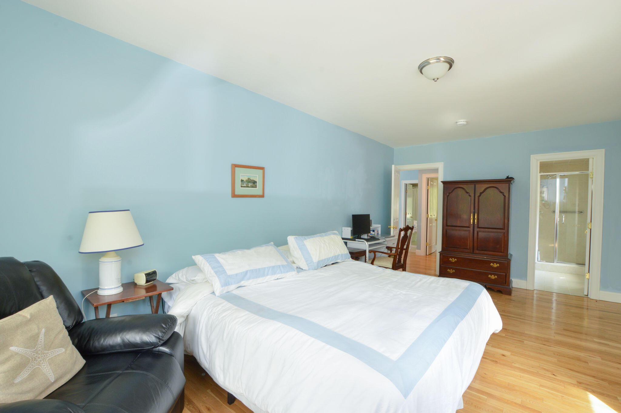 97 Willow Run Drive Centerville, MA 02632 - Photo 15 of 30 a bedroom with a bed and a lamp