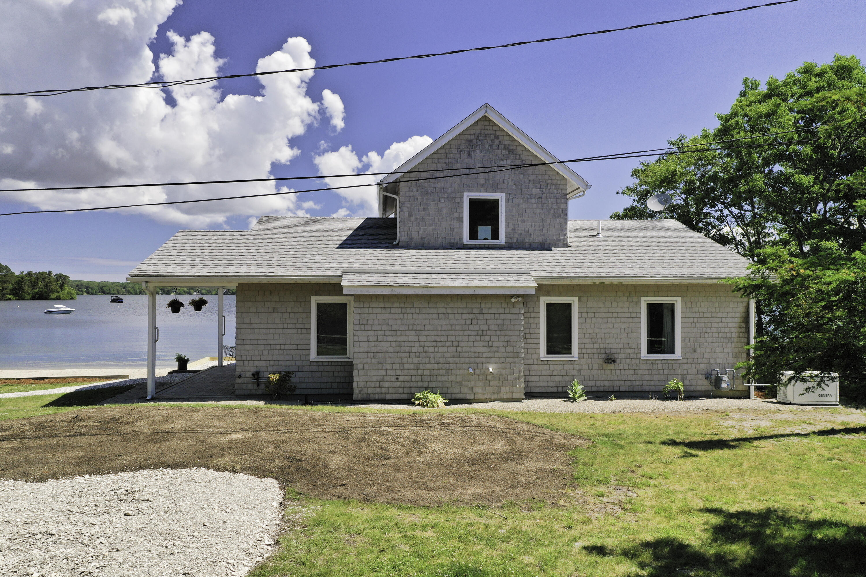 97 Willow Run Drive Centerville, MA 02632 - Photo 24 of 30 a view of a house with a yard and potted plants