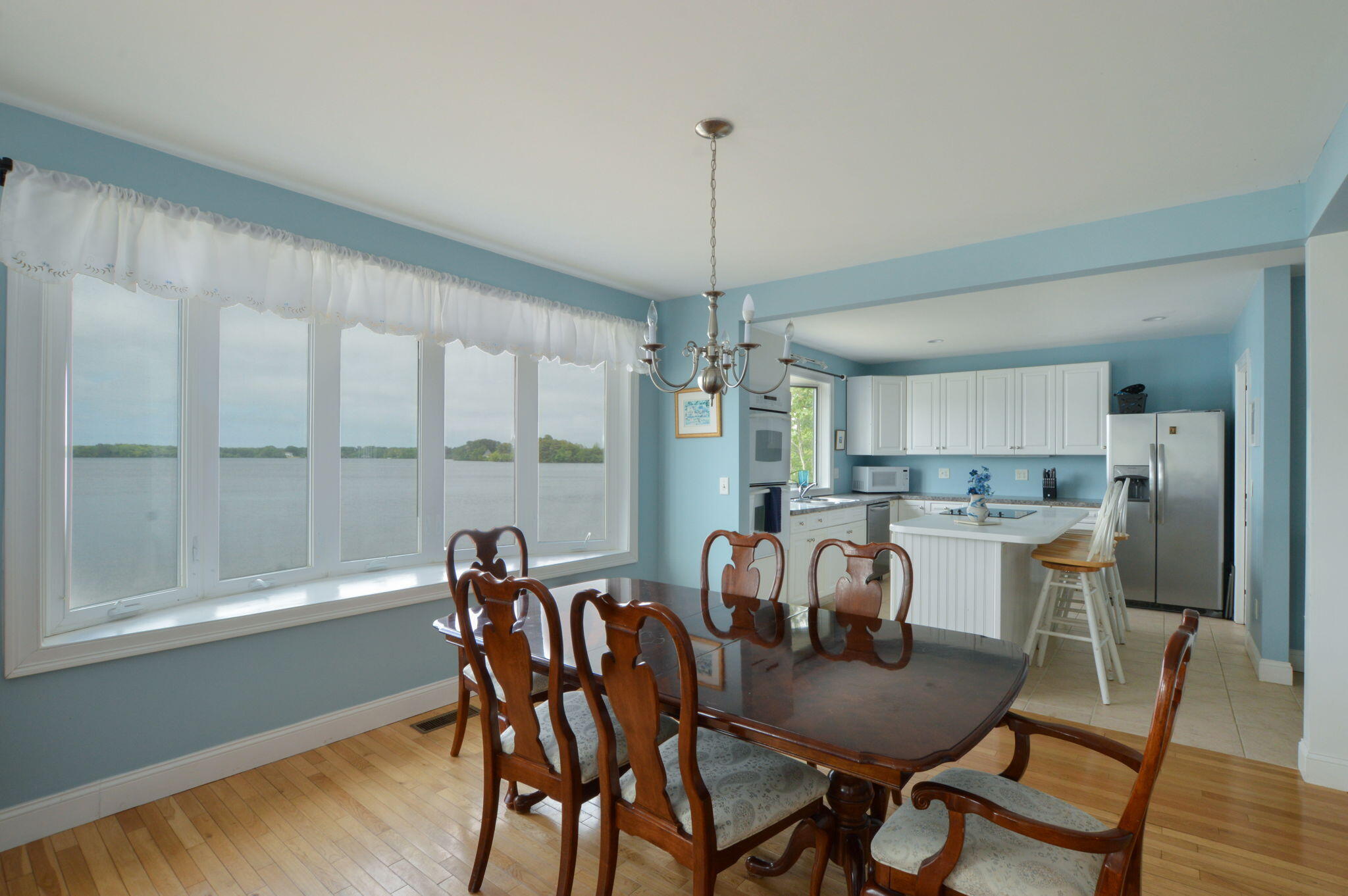 97 Willow Run Drive Centerville, MA 02632 - Photo 7 of 30 a view of a dining room with furniture window and wooden floor
