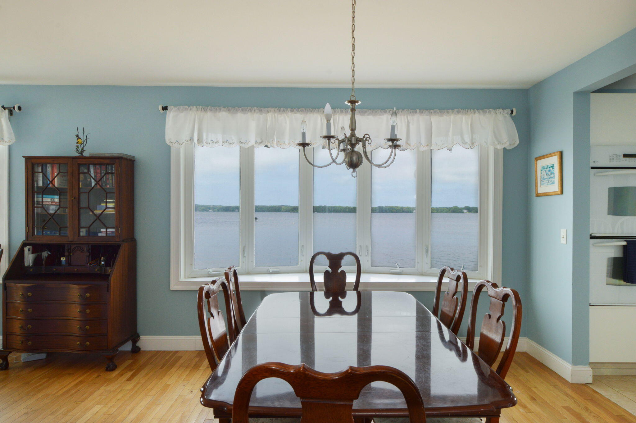 97 Willow Run Drive Centerville, MA 02632 - Photo 9 of 30 a view of a dining room with furniture window and wooden floor