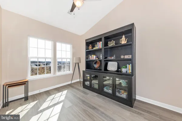 a view of a kitchen with wooden floor and a kitchen
