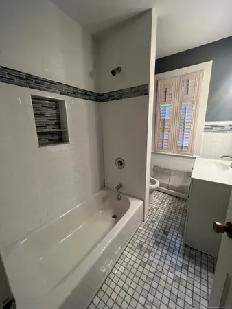 a bathroom with a sink vanity and a mirror