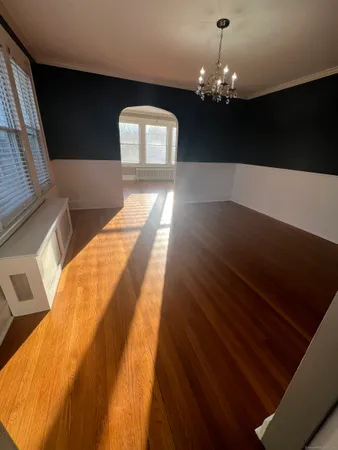 a view of kitchen and dining room with wooden floor