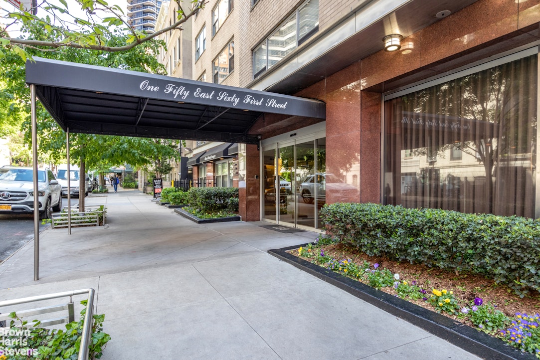 150 East 61st Street, Unit 5F Manhattan, NY 10065 - Photo 13 of 15 a view of a patio with table and chairs and potted plants