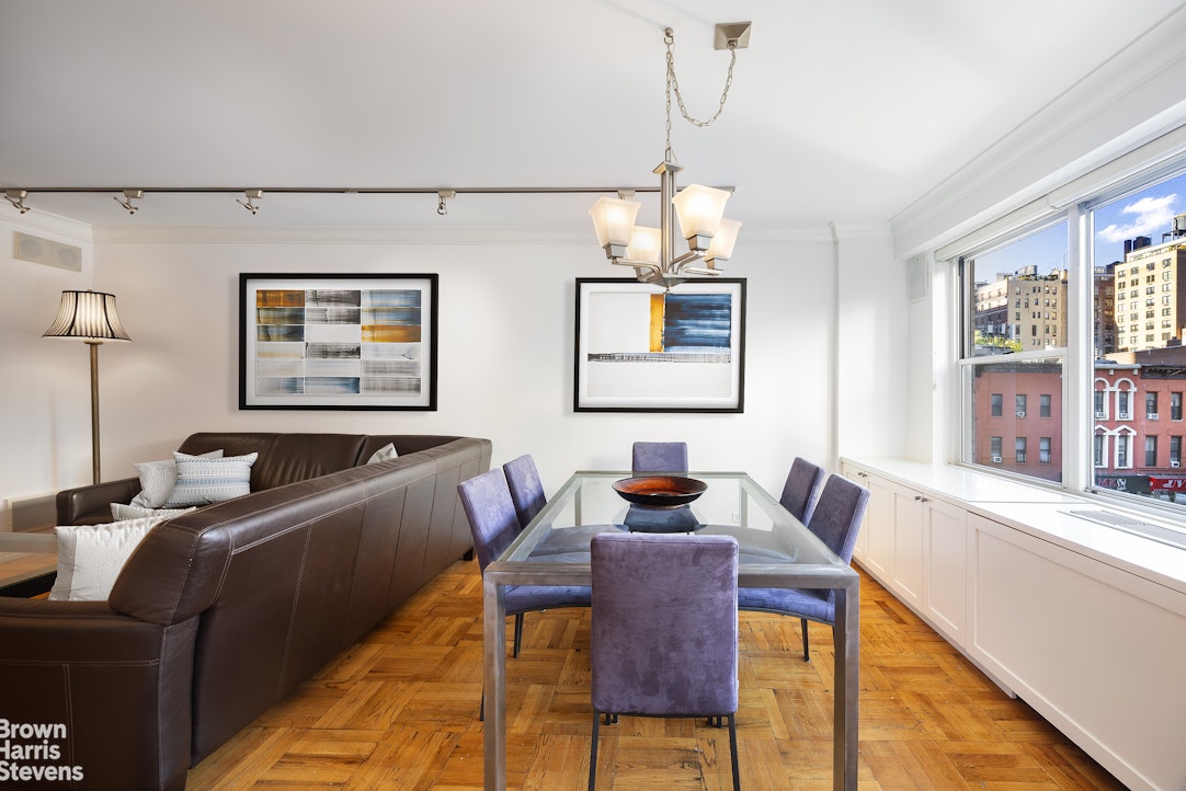 150 East 61st Street, Unit 5F Manhattan, NY 10065 - Photo 3 of 15 a living room with furniture