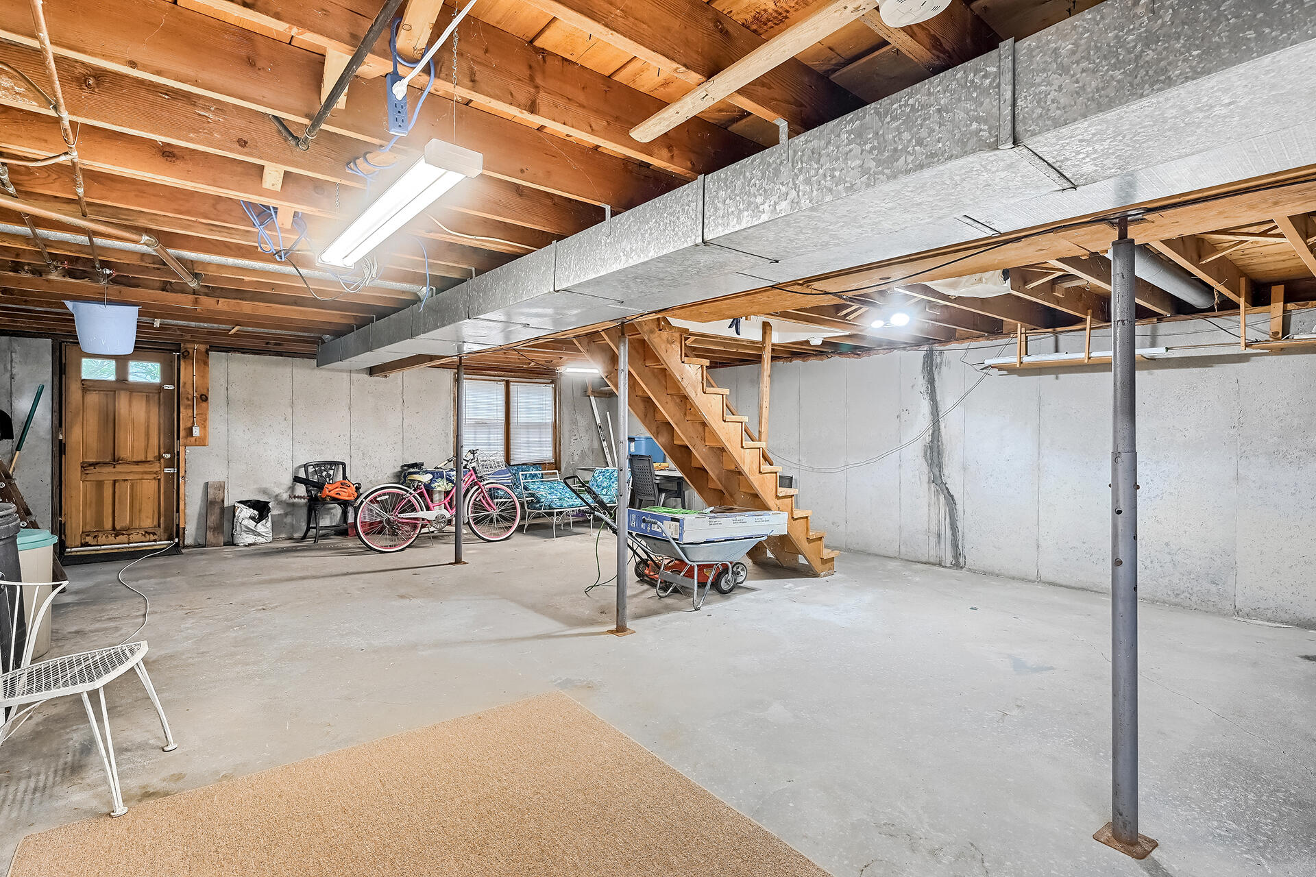 11 Mizzentop Lane Centerville, MA 02632 - Photo 16 of 18 a view of a garage with rack and bicycle