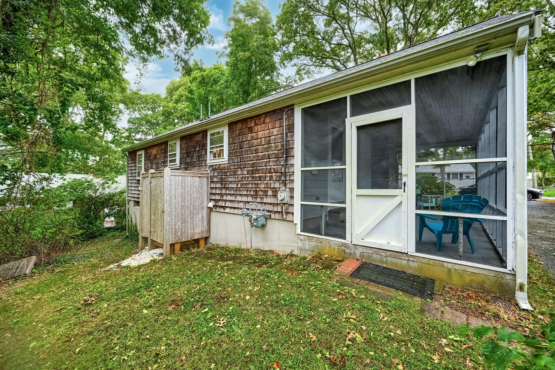 11 Mizzentop Lane Centerville, MA 02632 - Photo 18 of 18 a view of backyard with large tree and wooden fence