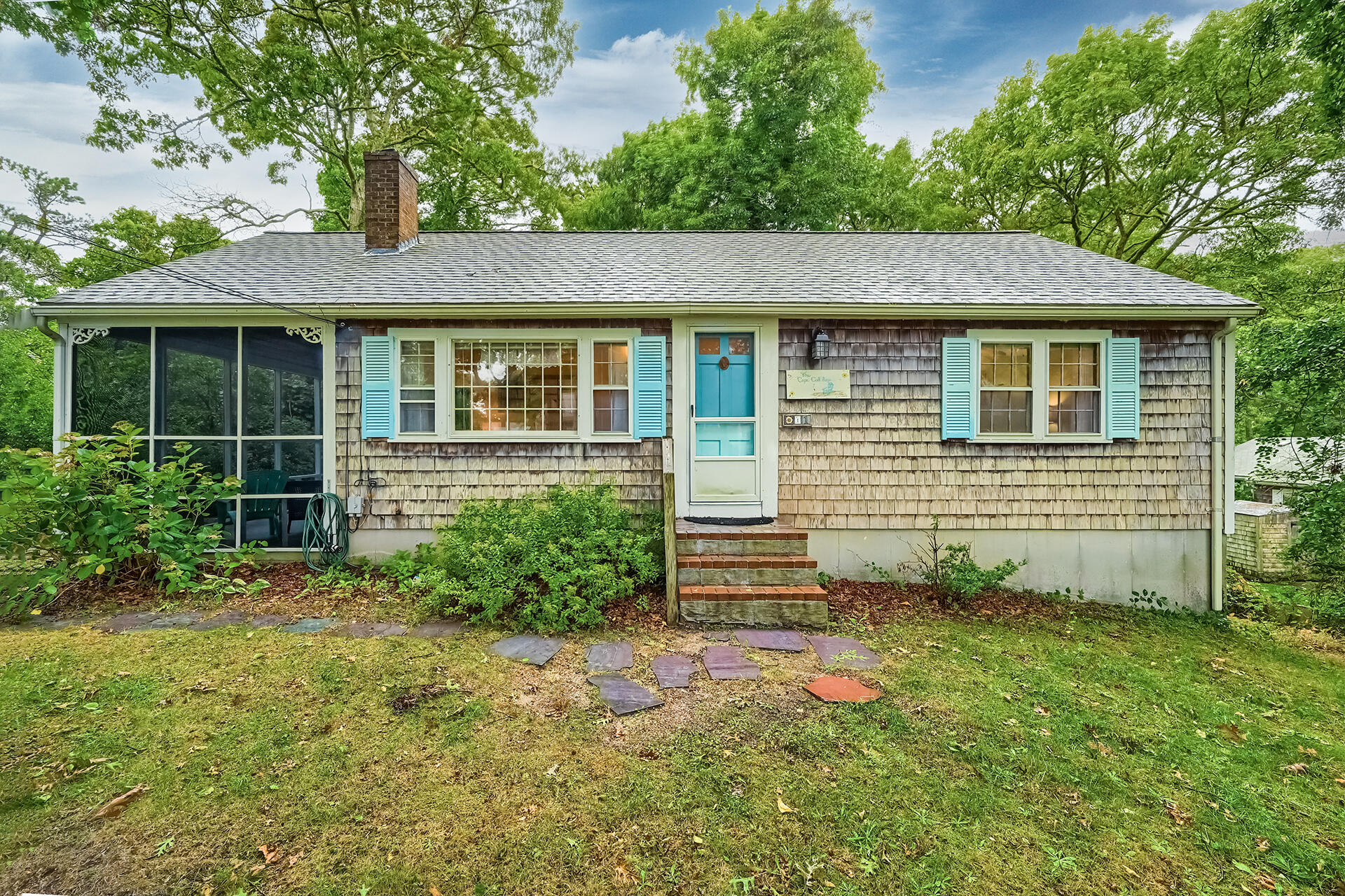 11 Mizzentop Lane Centerville, MA 02632 - Photo 2 of 18 front view of a house with a yard