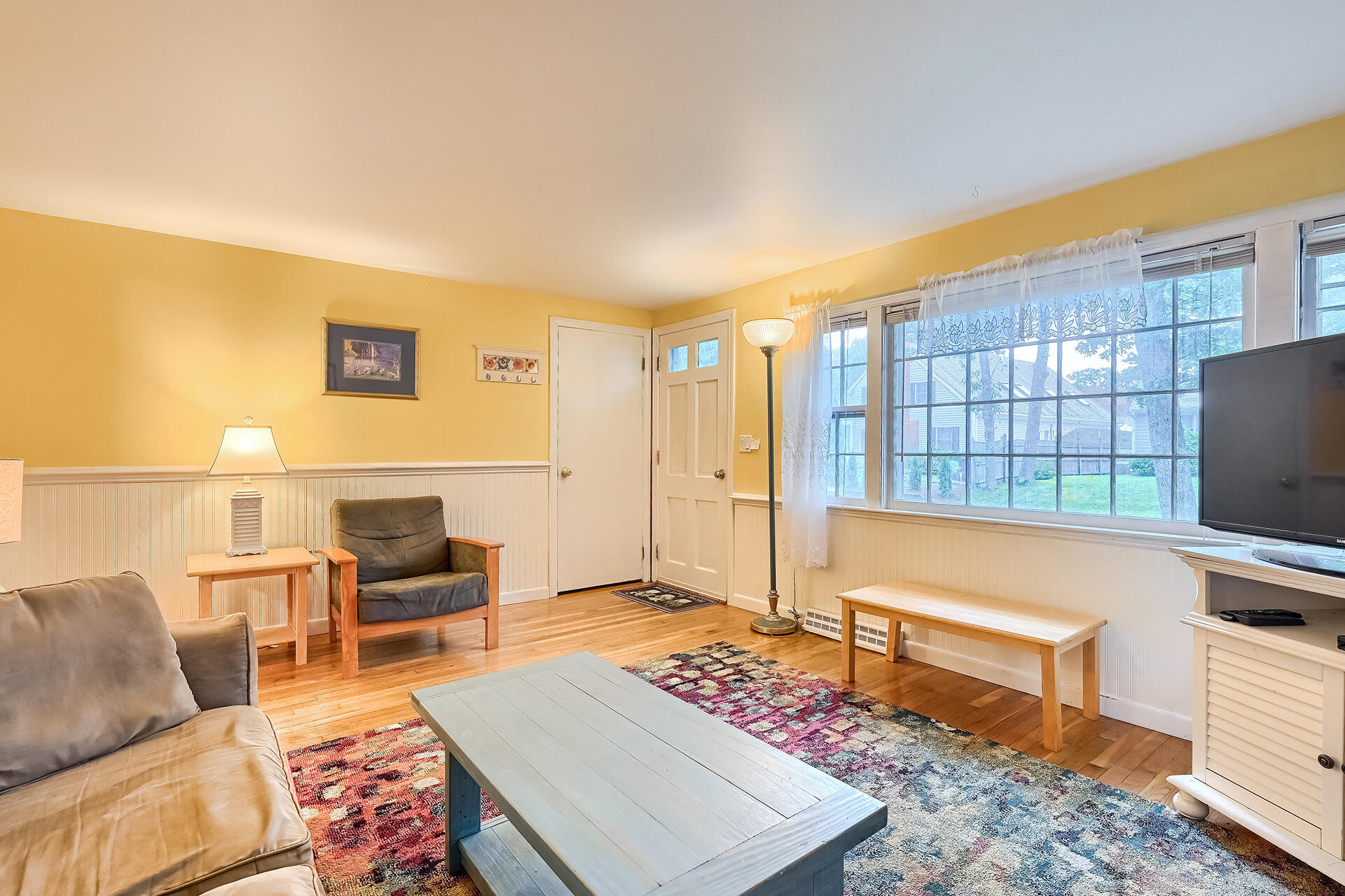 11 Mizzentop Lane Centerville, MA 02632 - Photo 4 of 18 a living room with furniture and a table