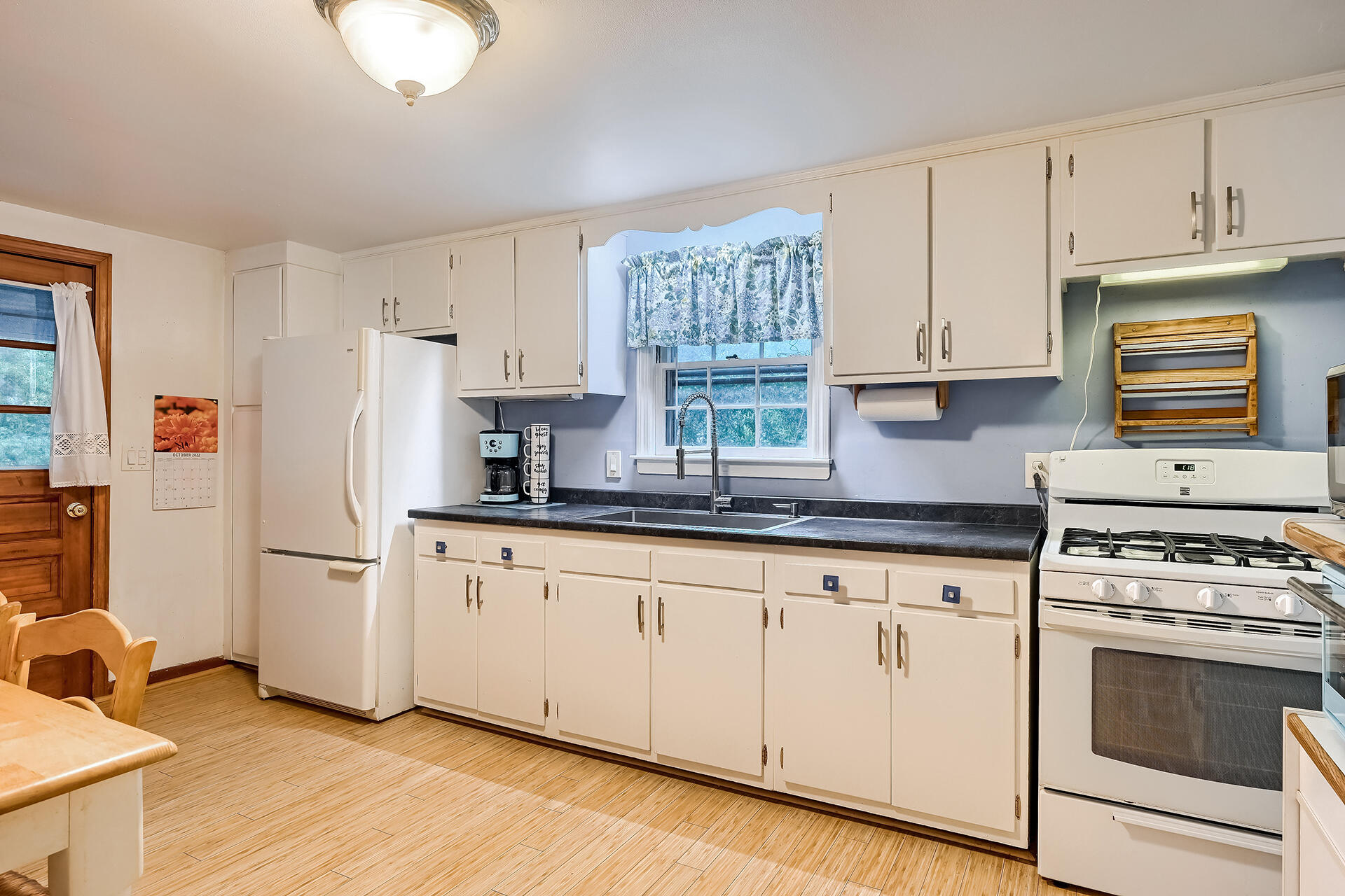 11 Mizzentop Lane Centerville, MA 02632 - Photo 5 of 18 a kitchen with granite countertop a sink cabinets stainless steel appliances and a window
