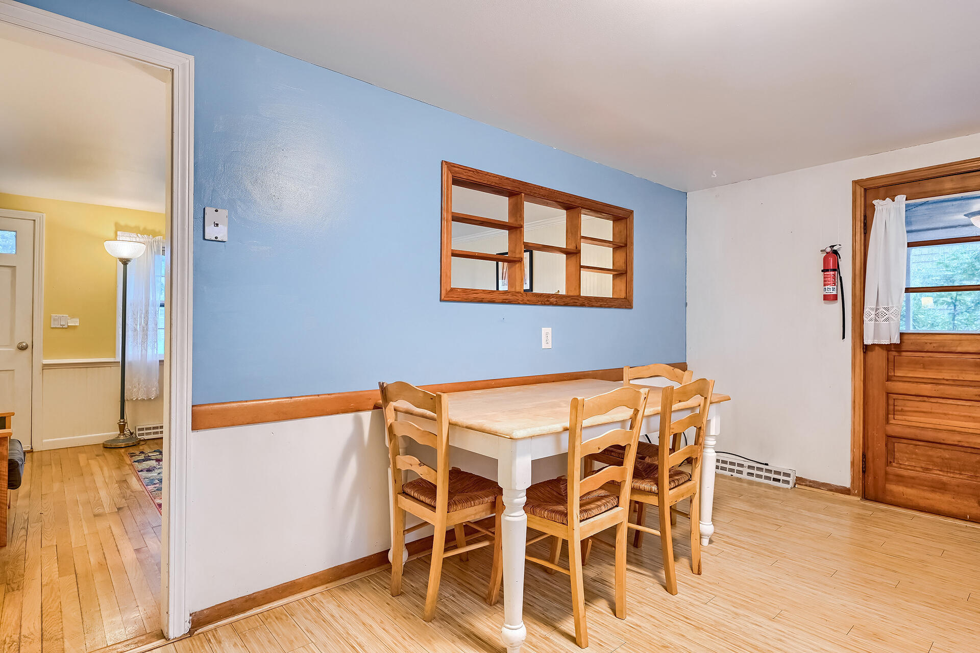 11 Mizzentop Lane Centerville, MA 02632 - Photo 7 of 18 a view of a dining room with furniture and wooden floor