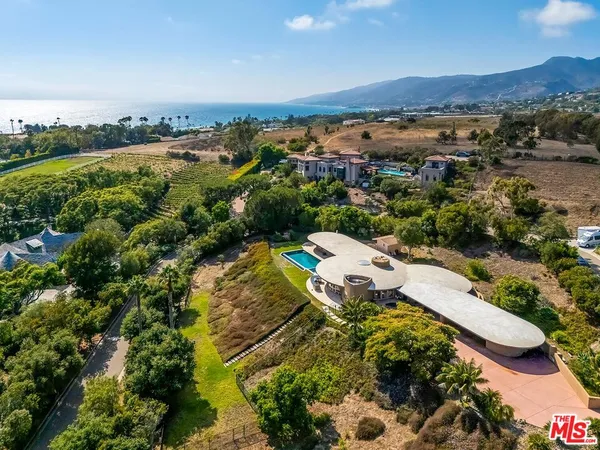 an aerial view of a house with a garden