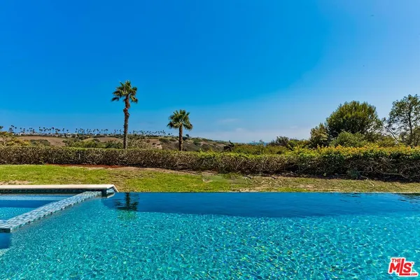 a view of swimming pool from a balcony