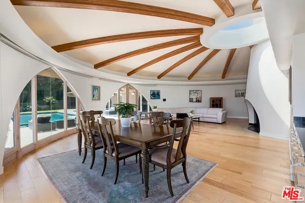 a dining room with furniture and window