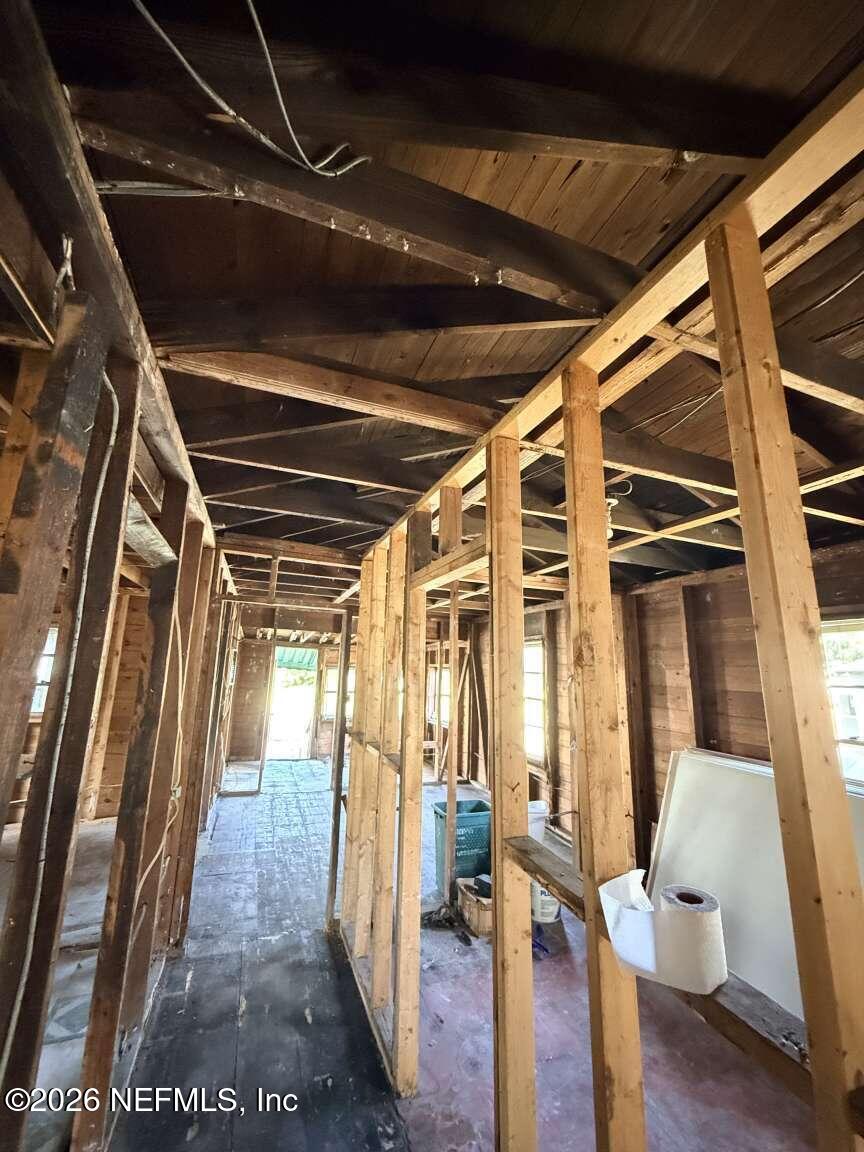 1828 West 3rd Street Jacksonville, FL 32209 - Photo 13 of 14 a view of an empty room with wooden floor and furniture