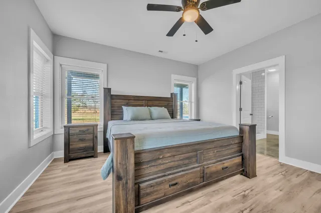 a bathroom with a sink vanity and mirror