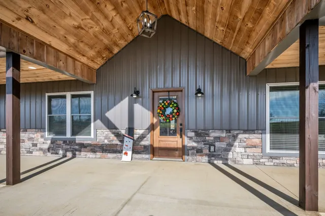 a view of a house with outdoor seating