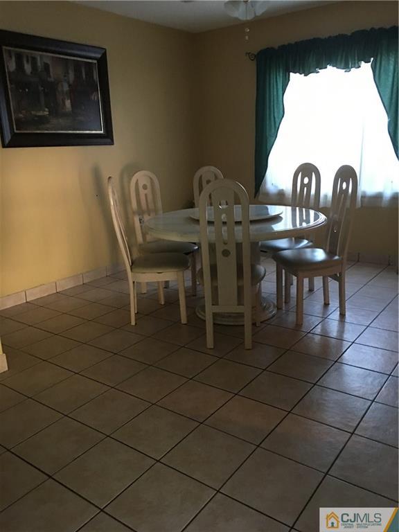 17 Stockton Road New Brunswick, NJ 08901 - Photo 5 of 12 a view of a dining room with furniture and window