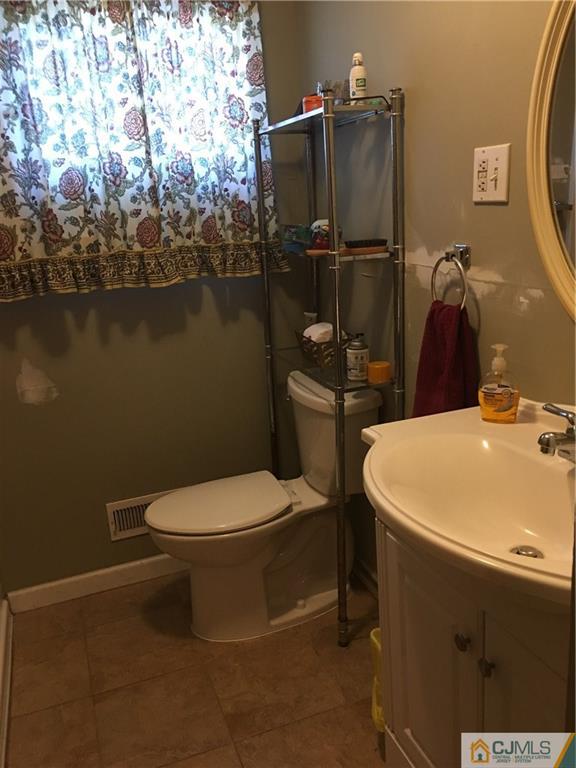17 Stockton Road New Brunswick, NJ 08901 - Photo 7 of 12 a bathroom with a sink and toilet