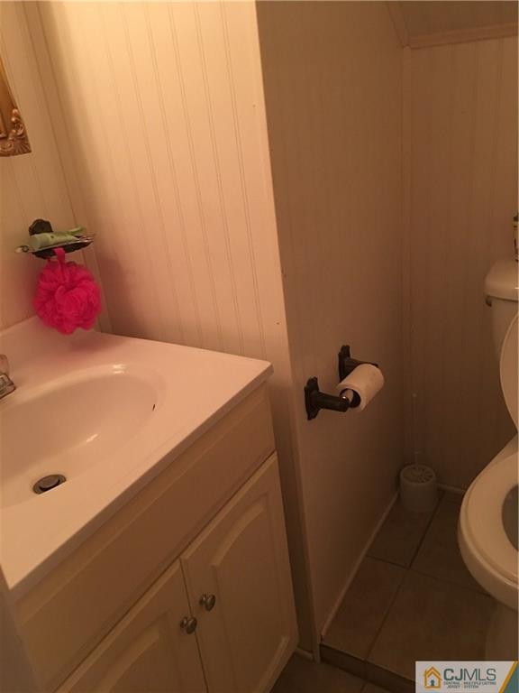 17 Stockton Road New Brunswick, NJ 08901 - Photo 9 of 12 a bathroom with a sink and toilet
