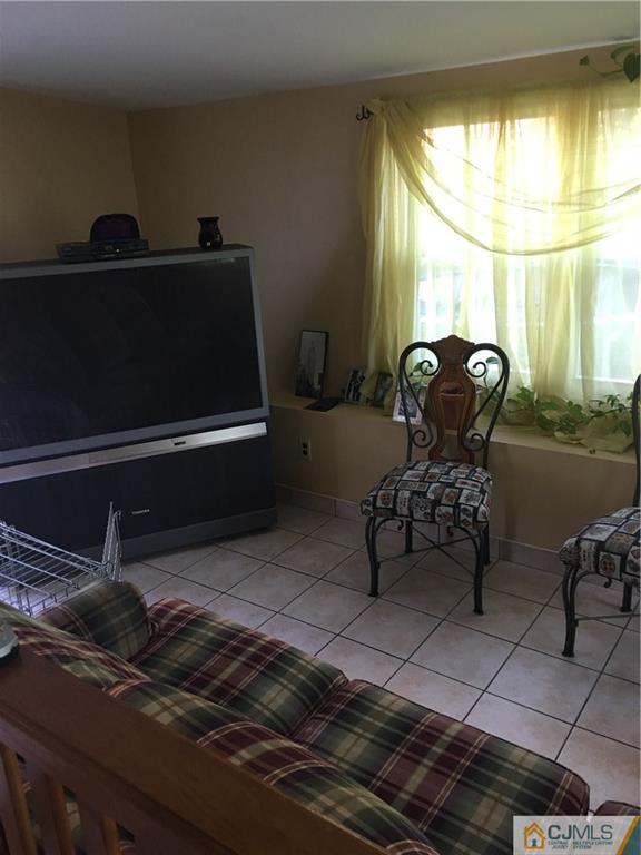 17 Stockton Road New Brunswick, NJ 08901 - Photo 10 of 12 a living room with furniture and a large window
