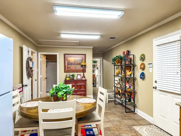 a room with a dresser and a window