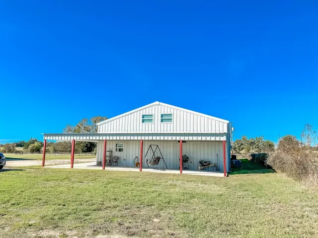 a view of a porch with seating space